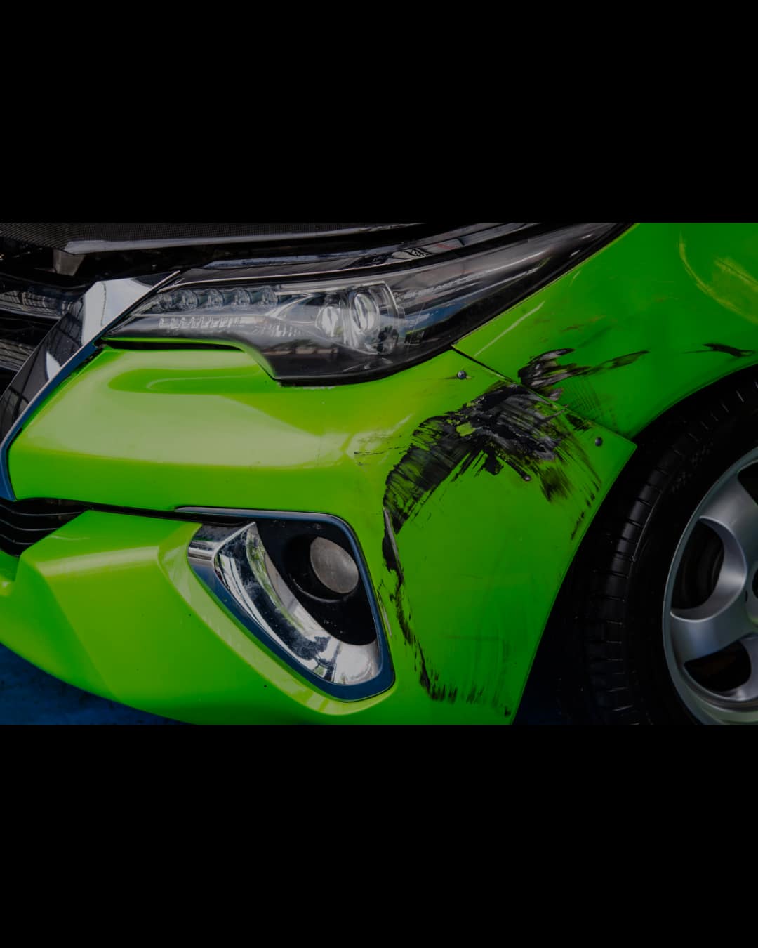 Damaged car bumper before repair at Auto Art in Austin TX