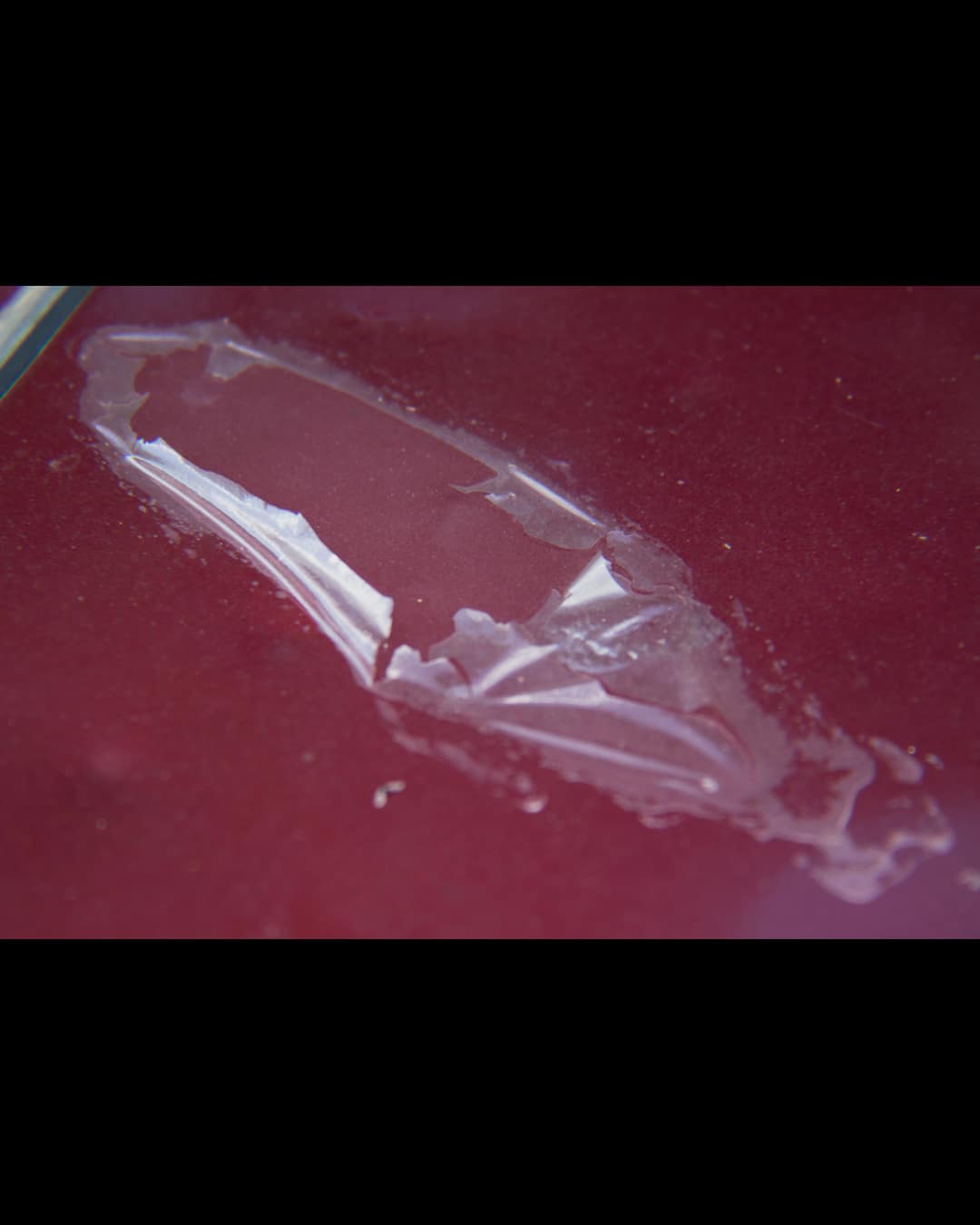 Peeling and oxidized clear coat on a vehicle before repair at Auto Art Austin TX