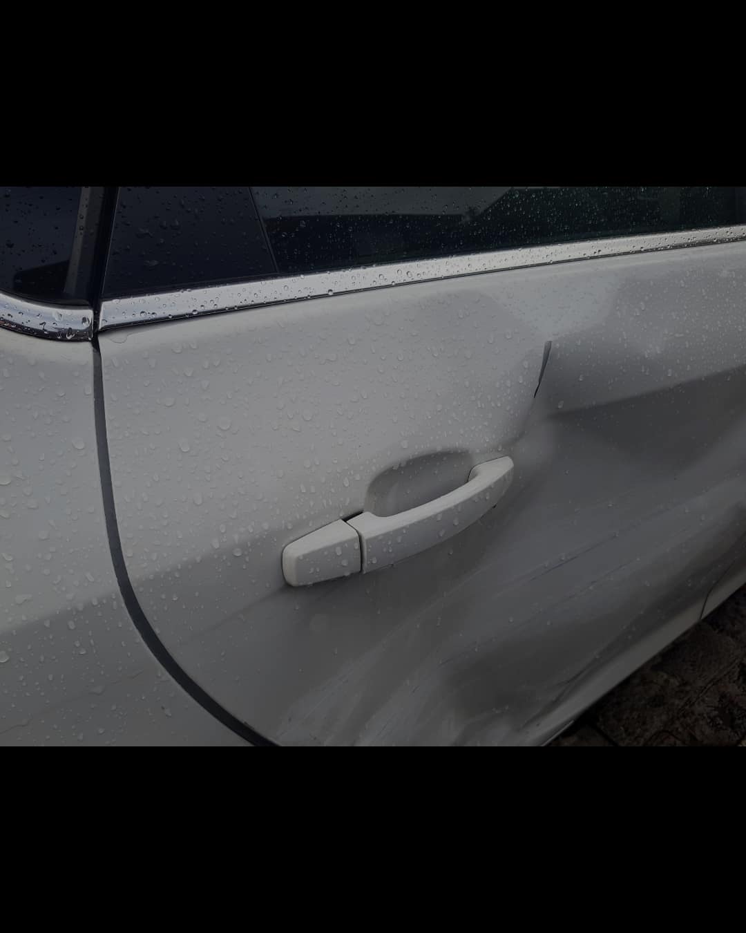 Panel dent with paint damage before repair at Auto Art Austin TX
