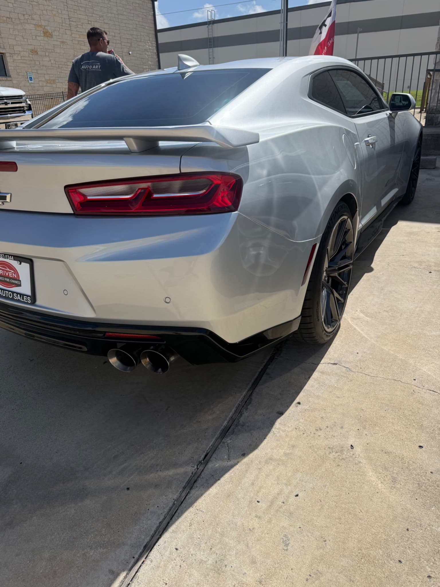 After: 2024 Camaro ZL1 rear bumper scuff repair before and after at Auto Art in Austin TX