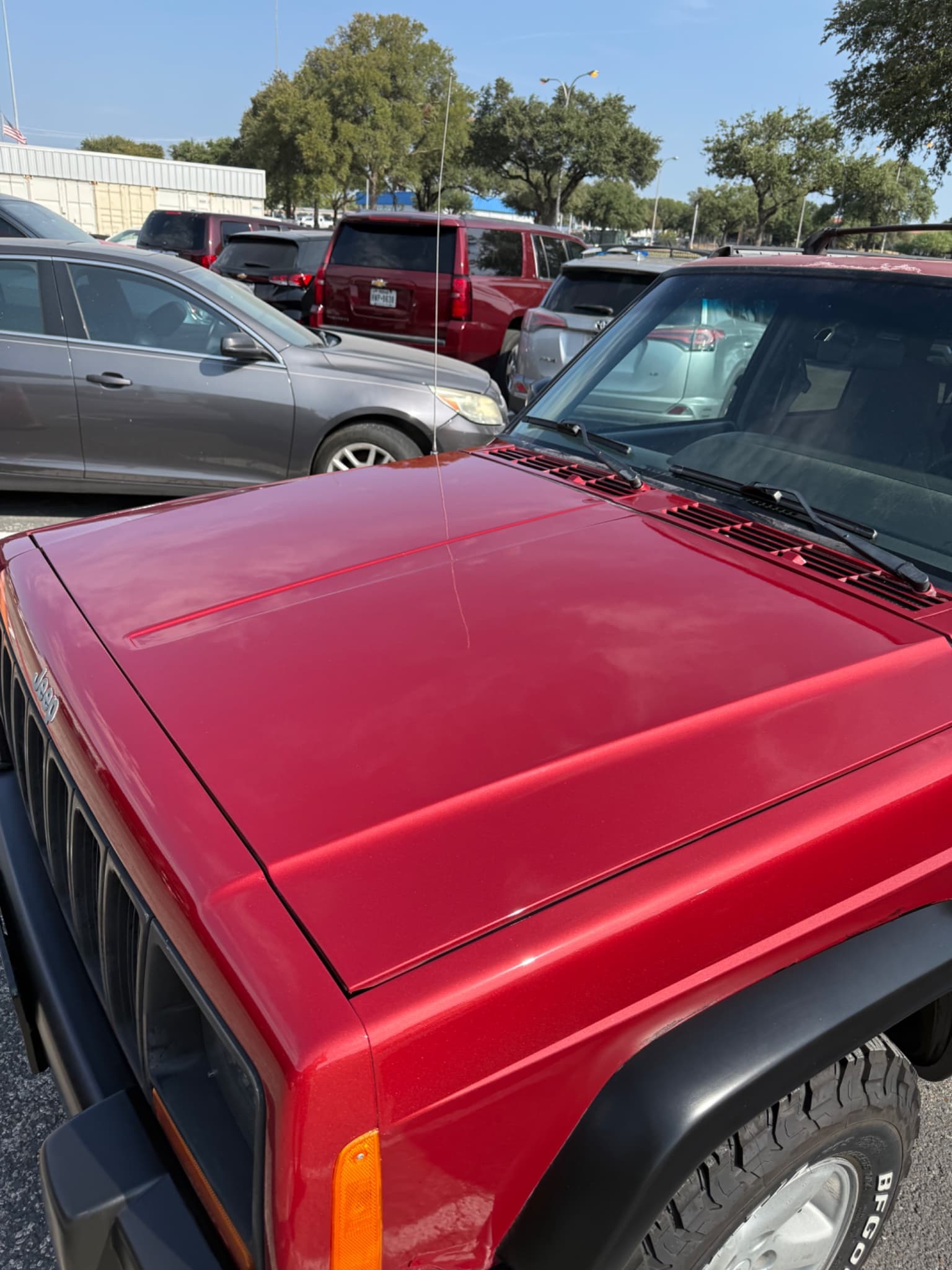 After: 2000 Jeep Cherokee hood before and after clear coat repair and repaint in Liberty Hill TX