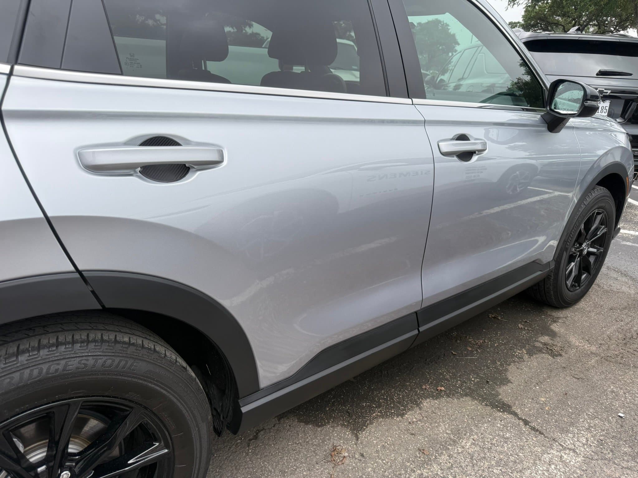 After: Before and after dent repair on 2025 Honda CR-V rear passenger door in Austin TX