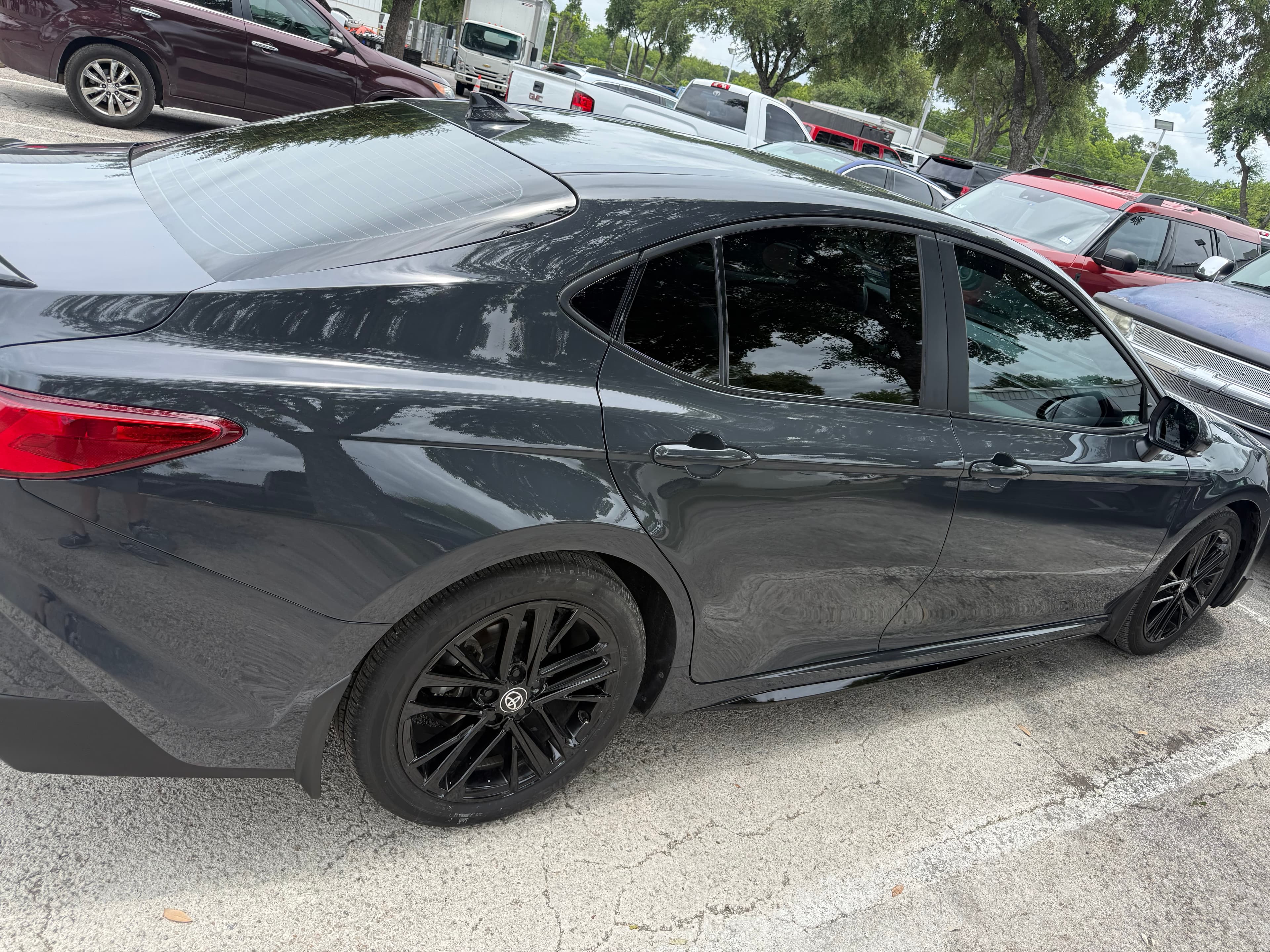 After: 2025 Toyota Camry sideswiped passenger doors before and after collision repair and repaint